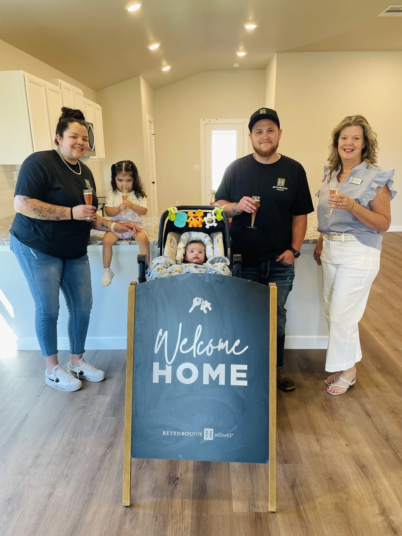A family celebrating their new home with a welcome-home gift