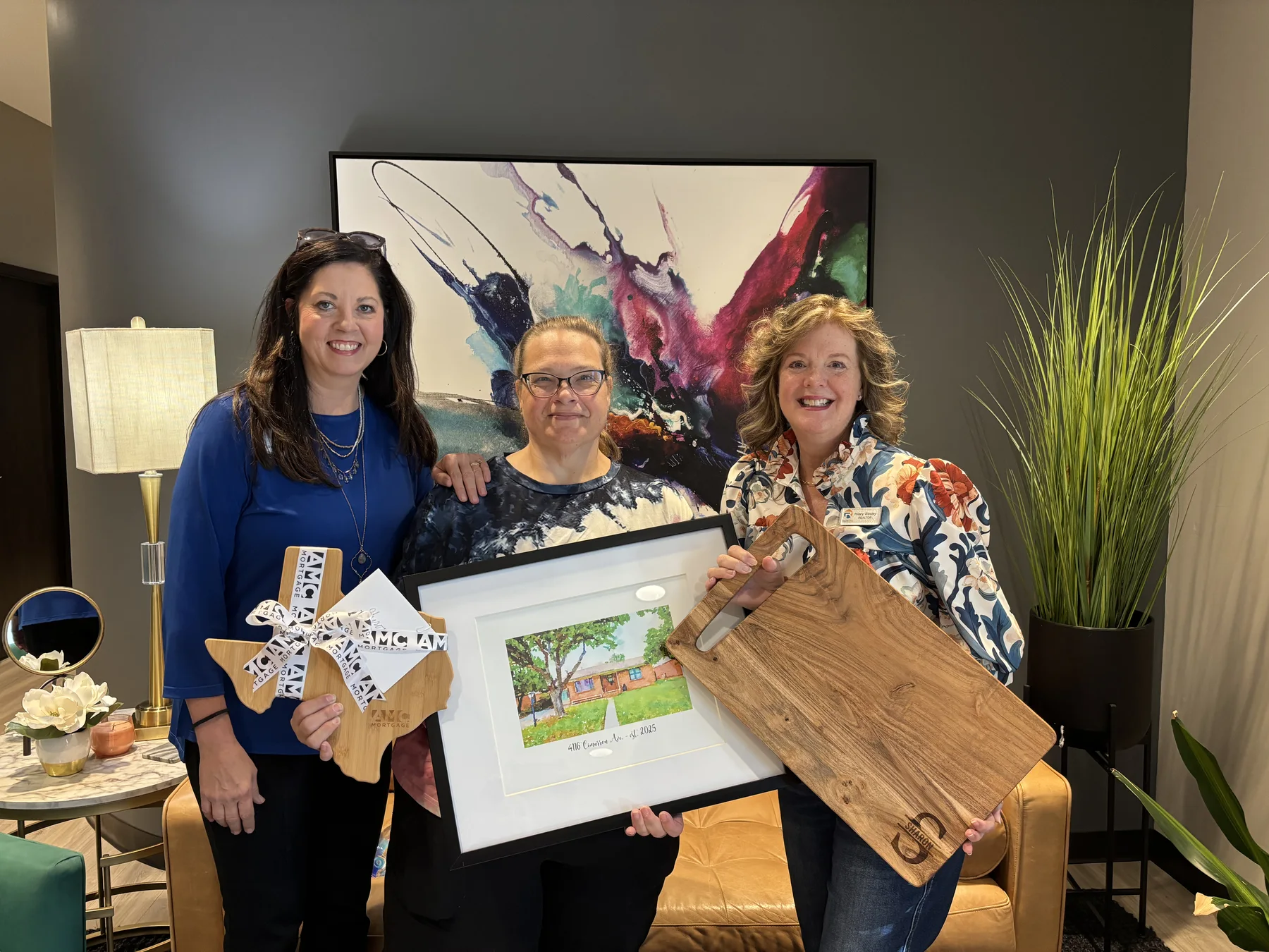 Happy home buyers celebrating with Hilary Wesley after their closing