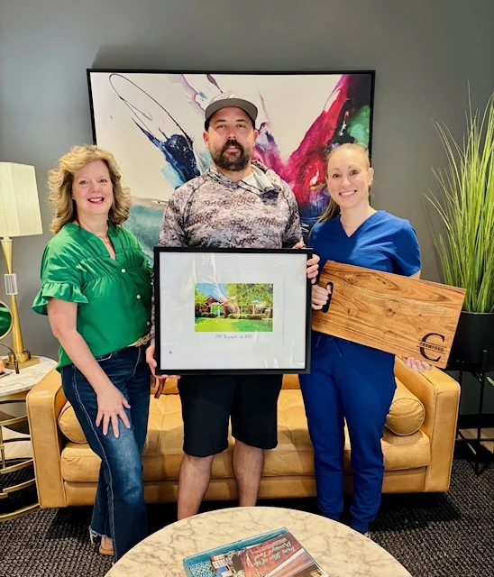 Happy home buyers celebrating together after receiving the keys to their new home
