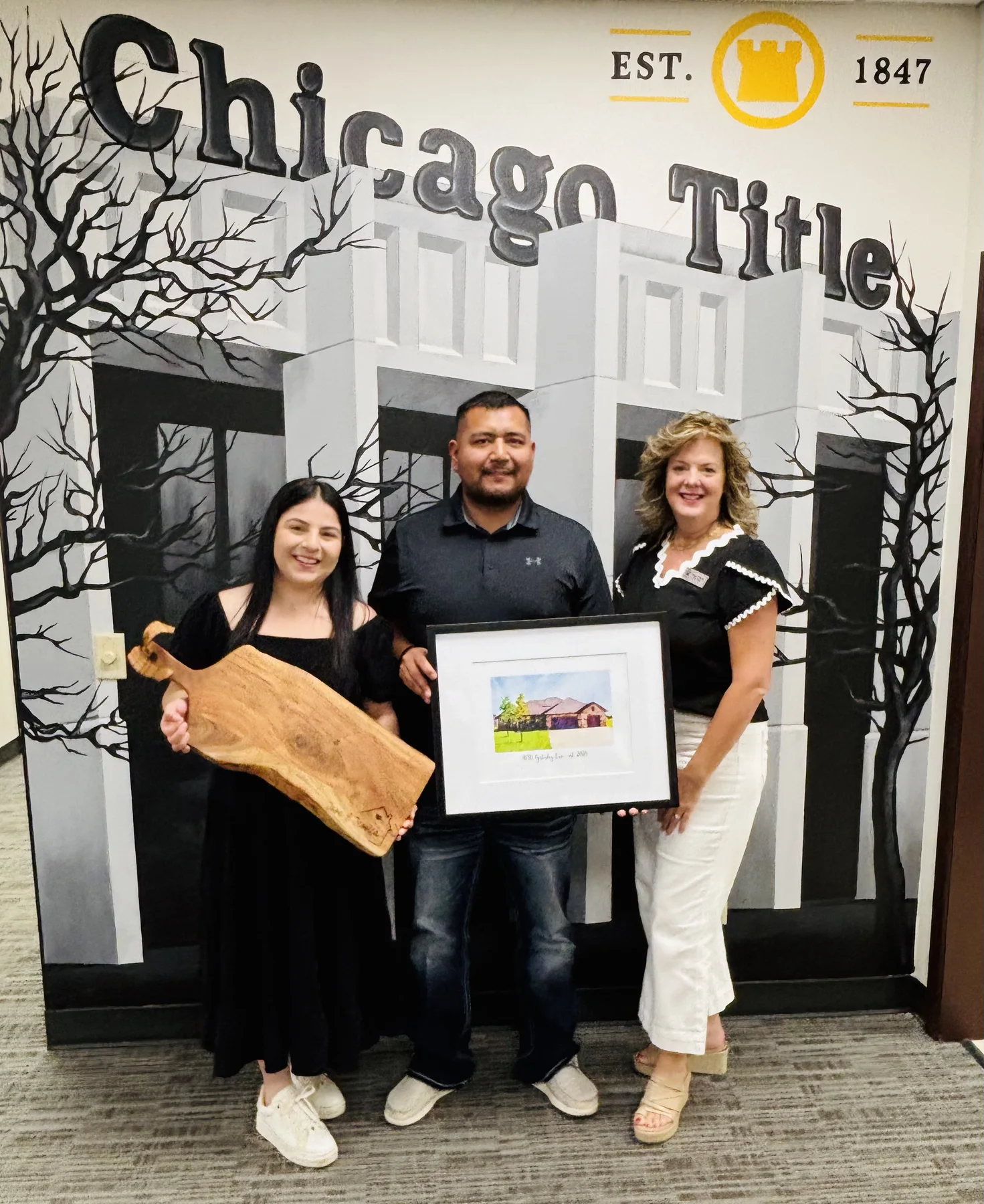 A couple celebrating their home purchase with Hilary Wesley
