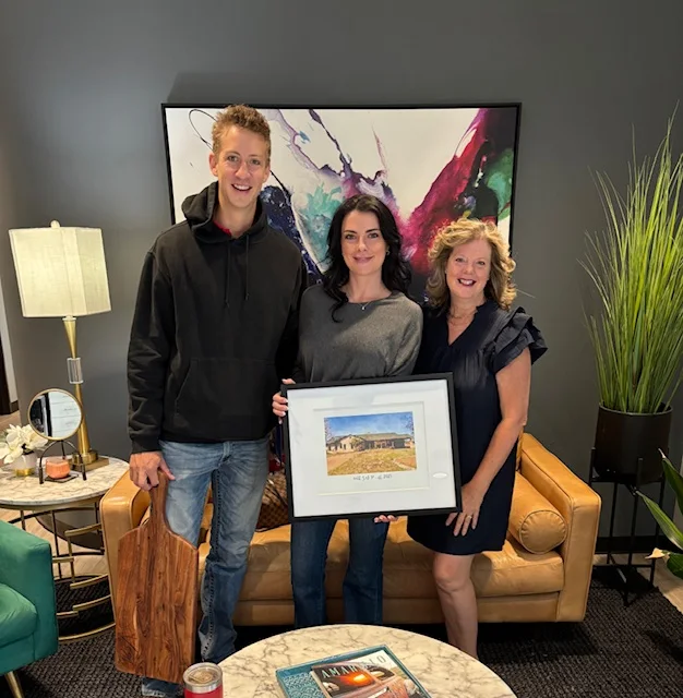 New homeowners celebrating with Hilary Wesley after closing on their home