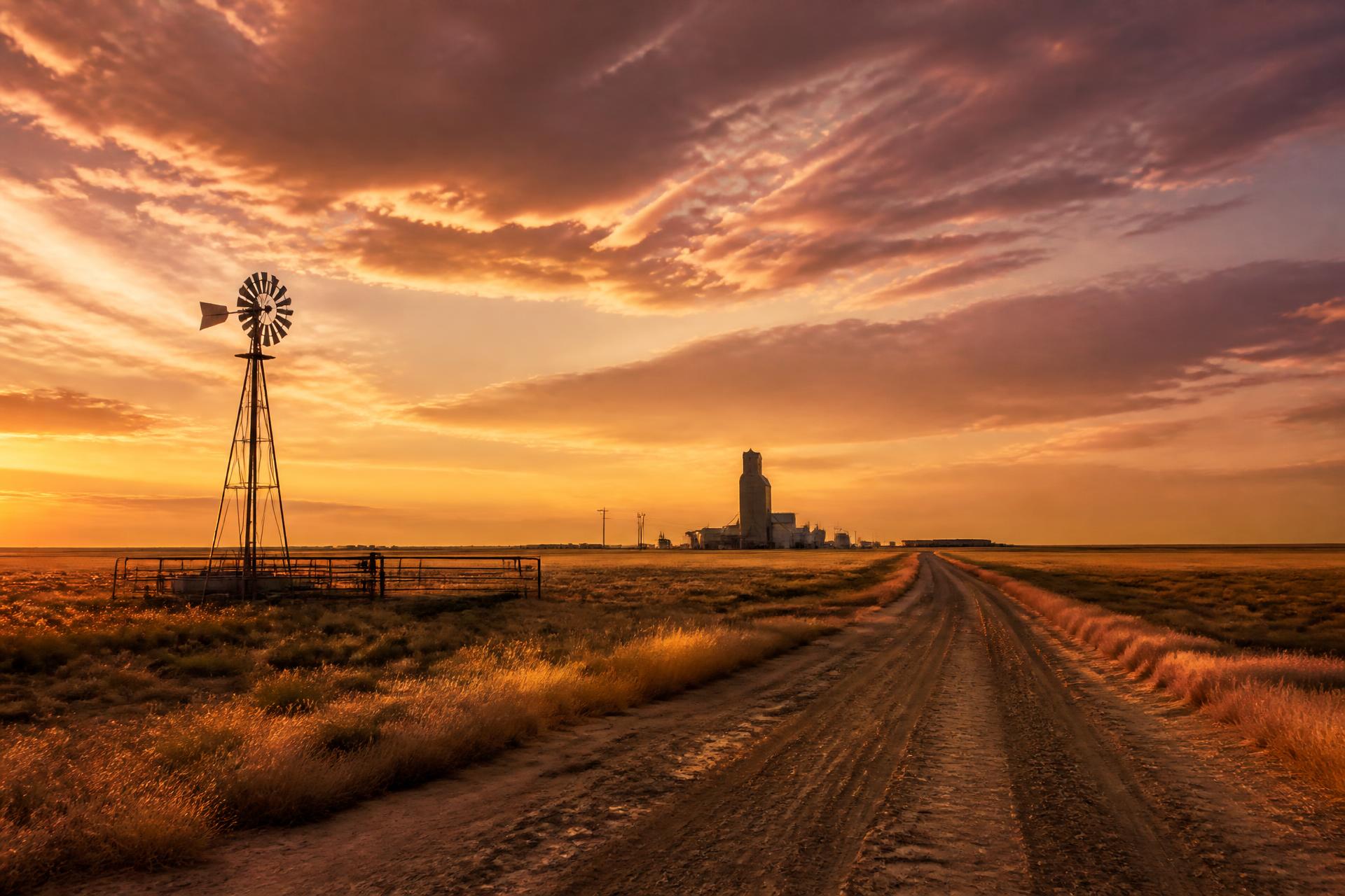 A Texas Panhandle sunset over open plains and a grain elevator